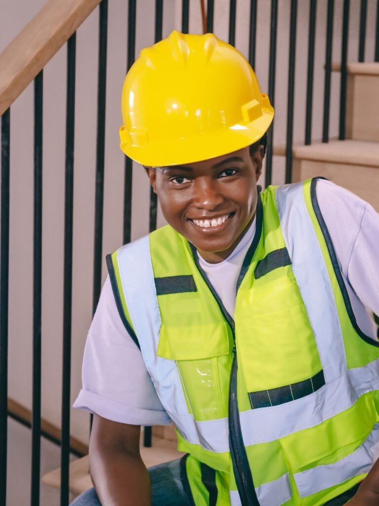 young woman wearing a construction hat